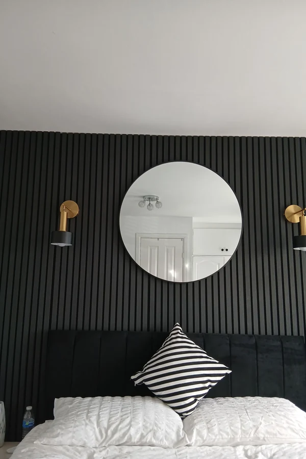 18 Above Bed Decor Ideas to Make Your Bedroom Feel Cozy and Stylish 4 Add a Round Mirror for a Softer Look