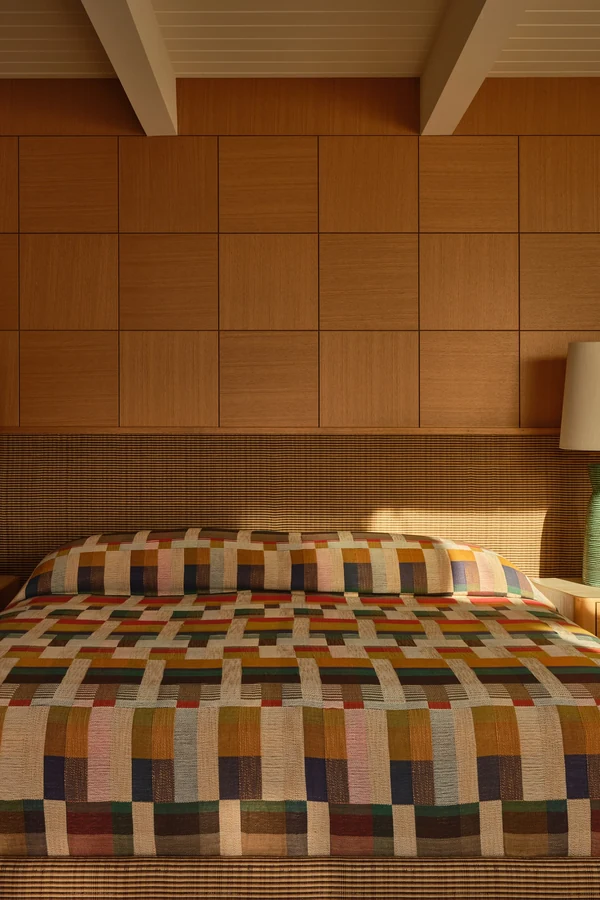 18 Above Bed Decor Ideas to Make Your Bedroom Feel Cozy and Stylish 9 Add Wood Panels Behind the Bed for Warmth