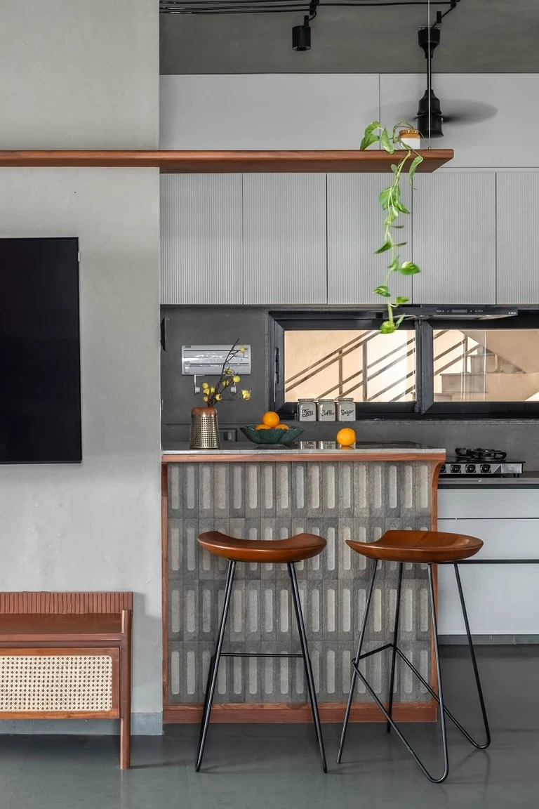 18 Small Kitchen Partition Ideas 3 Tiled breakfast counter with two wood stools between a kitchen and a living area