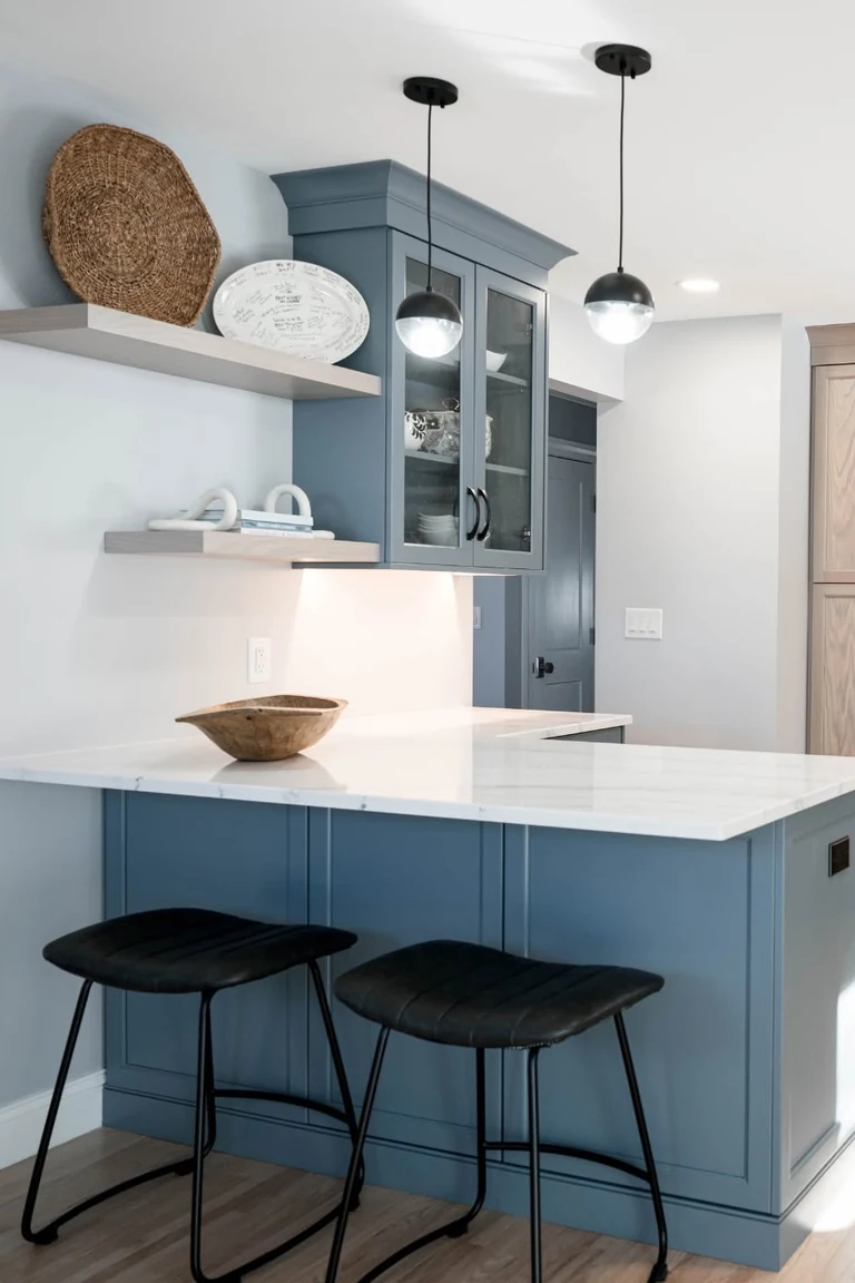 18 Small Kitchen Partition Ideas 6 Blue kitchen peninsula with a white countertop and two black bar stools