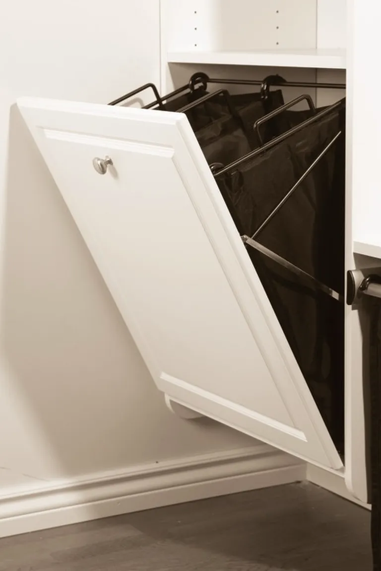 Pull out hamper inside a laundry cabinet with a washable liner bag
