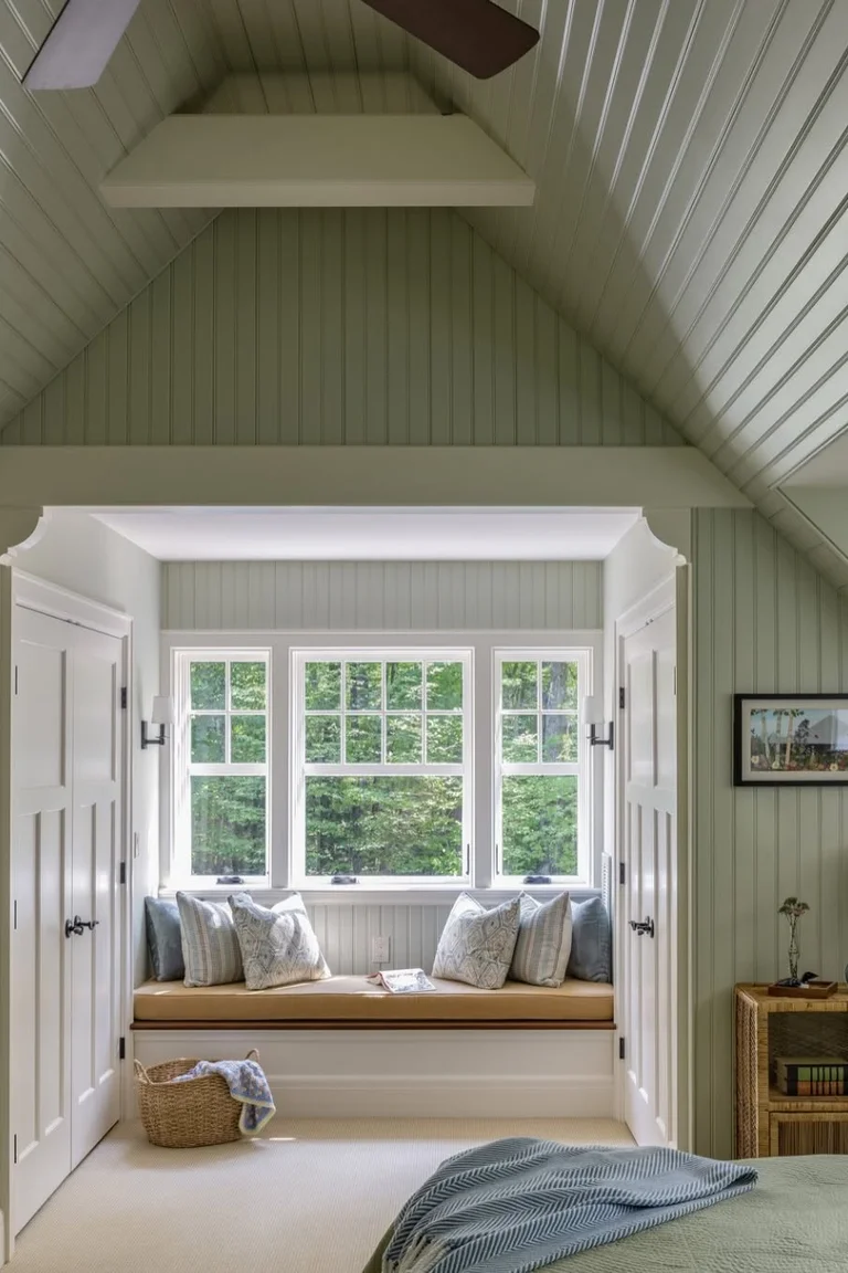 25 Stunning Accent Wall Ideas for Every Room and Style 19 Cottage attic bedroom with beadboard walls and ceiling, a window seat, patterned rug and the edge of a bed in the foreground