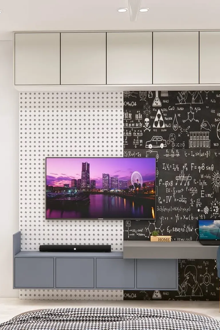 25 Stunning Accent Wall Ideas for Every Room and Style 24 Home office corner with a black chalkboard-style wall covered in chalk doodles and formulas, a desk with a chair and laptop, and a TV wall