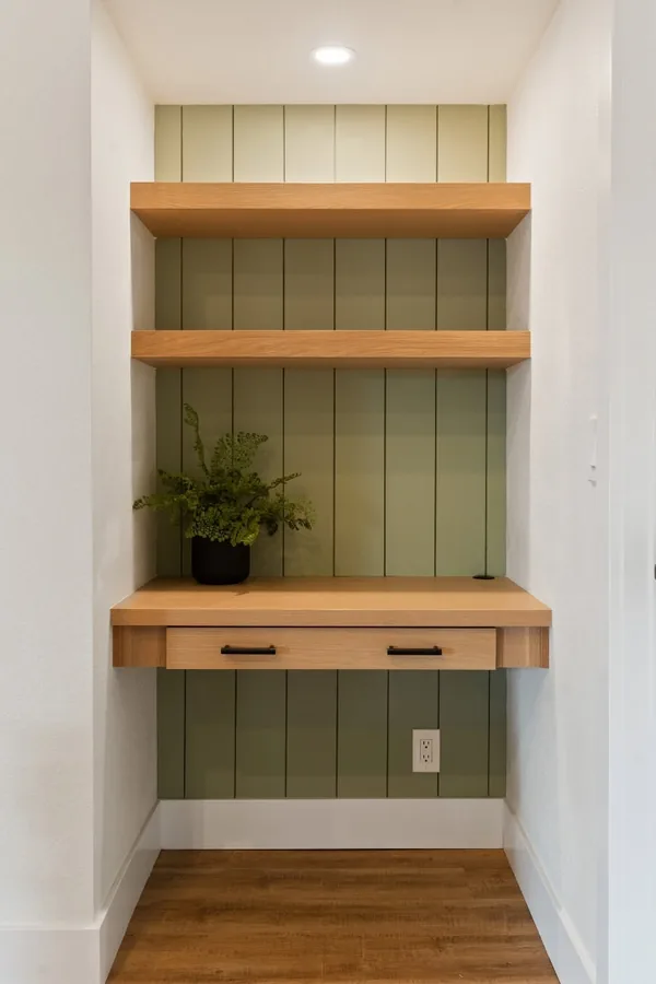 17 Empty Corner Living Room Ideas to Make Your Space Feel Complete 6 Turn a Dead Corner Into a Small Desk Nook With a Wall Shelf Above
