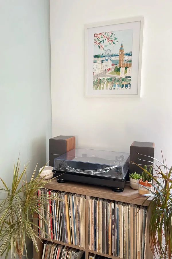 17 Empty Corner Living Room Ideas to Make Your Space Feel Complete 15 Create a Music Corner With a Record Player Stand and Vinyl Storage